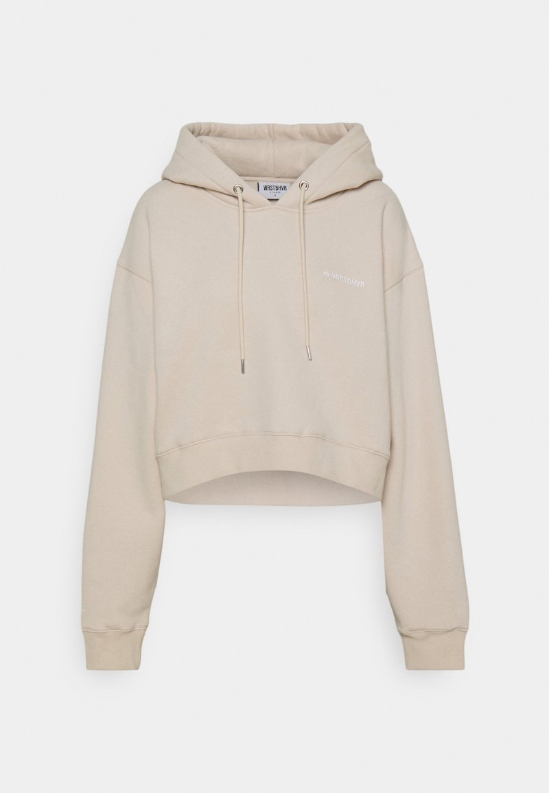 Sweat à capuche beige raccourci avec manches longues, cordons à l'avant, poignets côtelés, et petit texte logo sur le côté gauche de la poitrine.