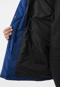 Blue insulated jacket with a black interior, featuring a smooth texture, zipper closure, and elastic drawstring inside for adjustable fit.