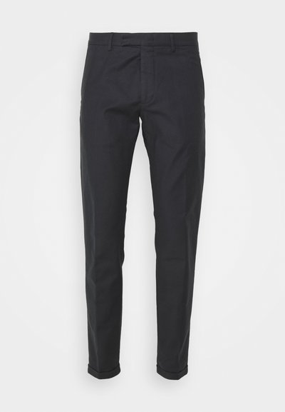 Dark navy trousers with a straight fit, made of cotton blend fabric, featuring a smooth texture and rolled cuffs.
