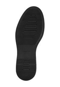 Black rubber sole with a textured surface for grip, featuring horizontal and vertical grooves and embossed brand name "Massimo Dutti."