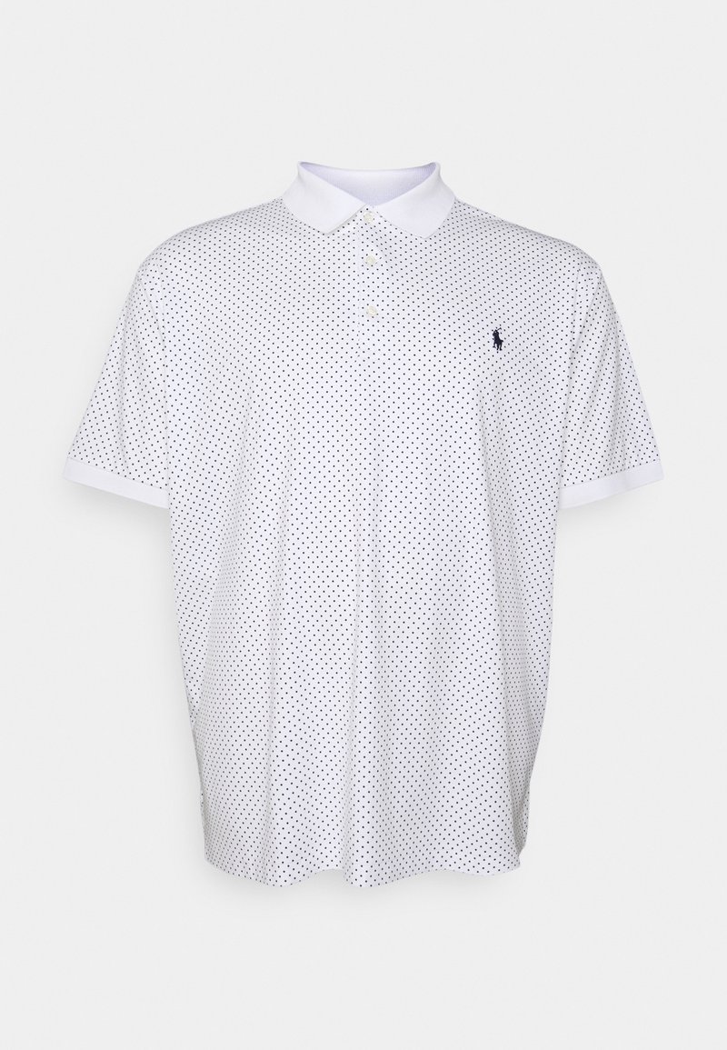 White polo shirt with black polka dots, short sleeves, and a standard collar. Features a small logo on the chest. Made of smooth fabric.