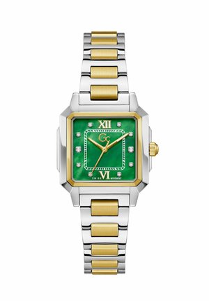 Kwadratowy srebrno-złoty zegarek na nadgarstek z zieloną tarczą, złotymi wskazówkami, diamentowymi znacznikami godzin oraz dwukolorową metalową bransoletą.