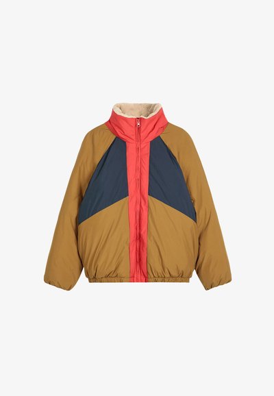 Puffer jacket with tan sleeves, navy blue triangular panels, and a red front zipper strip, featuring a high collar with beige fleece lining.