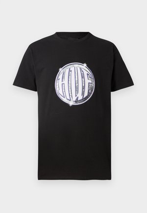 Black cotton t-shirt featuring a circular, reflective graphic with the letters "HUF" in white. Short sleeves and a standard crew neck design.