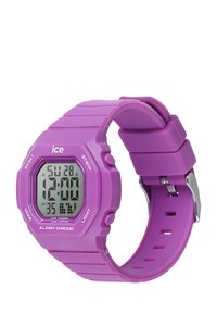 Reloj digital con una esfera octogonal, correa de goma morada y pantalla LCD negra. Las características incluyen alarmas, función de luz y resistencia al agua.