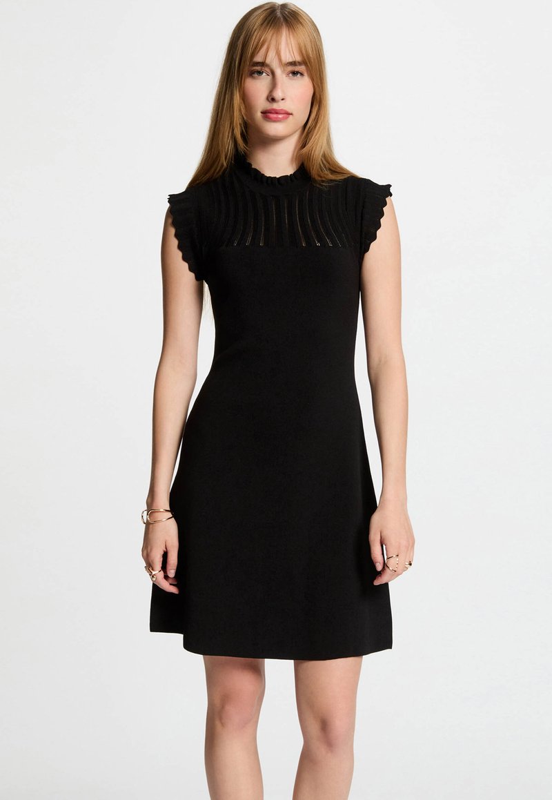 Black dress with a fitted bodice, pleated texture at the neckline, and ruffled short sleeves. Soft material with a flared skirt.