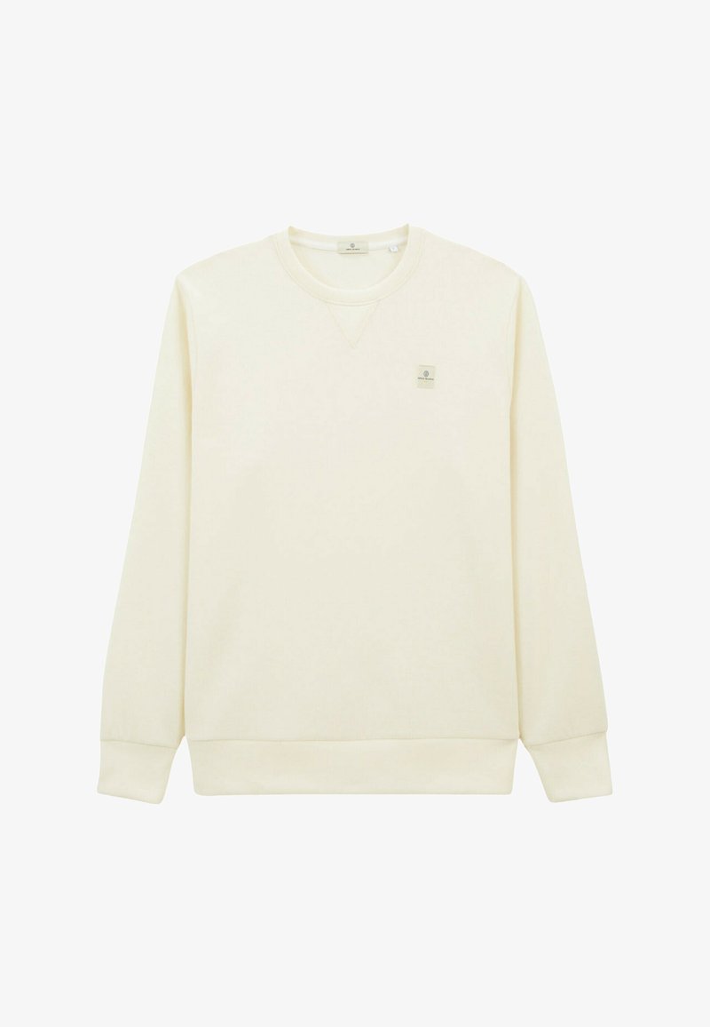 Sweatshirt couleur crème avec manches longues, bords côtes aux poignets et à l'ourlet, design en V, comportant un petit patch logo sur le haut de la poitrine gauche.