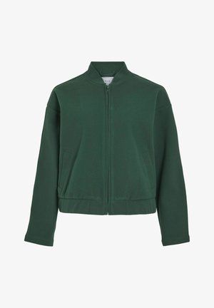 Roheline, lühike bomber-jakk kõrge kaelusega, esiseeliku ja kahe küljetaskuga. Valmistatud pehmest ja siledast kangast ühtlasest värvist.