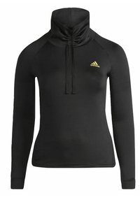 Haut de sport noir à manches longues avec col montant et cordon, avec un petit logo Adidas jaune sur la poitrine gauche.