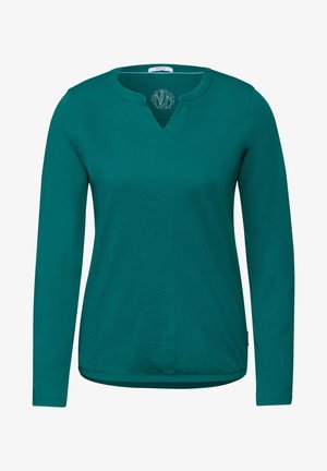 Teeformige langärmlige Bluse in Teal mit Rundhalsausschnitt und leichtem V-Ausschnitt vorne. Weicher Stoff mit glatter Textur und ohne Muster.