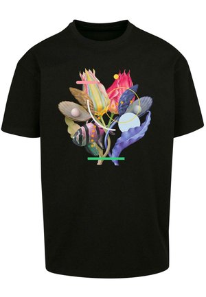 Black t-shirt featuring a colorful floral and abstract design with shapes and circular accents. Material appears soft with a relaxed fit.
