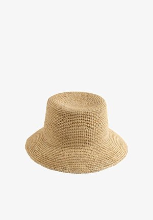 Beiger handgewebter Strohhut mit breiter Krempe, runder Krone und strukturierter Oberfläche, mit glattem Finish und natürlichen Farbvariationen.