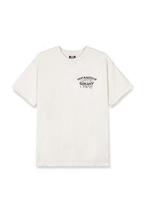 Camiseta de algodón color crema con un gráfico de texto negro "INFAMOUS" con un efecto goteante, ajuste relajado y mangas cortas.