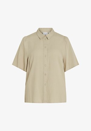 Chemise beige à manches courtes avec un col pointu, des manches légèrement bouffantes et un ourlet droit. Confectionnée en tissu tissé doux.