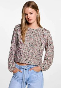 Bloemdruk cropped blouse met ruches op de schouders, lichtgewicht stof, lange mouwen en pastelkleuren in roze, blauw en crèmekleurig.