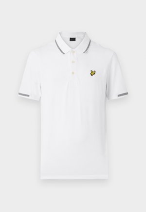 Bela polo majica z zapenjanjem na tri gumbe, sivo-prugast ovratnik in manšete ter rumeno vezeno logo na levem prsnem delu.