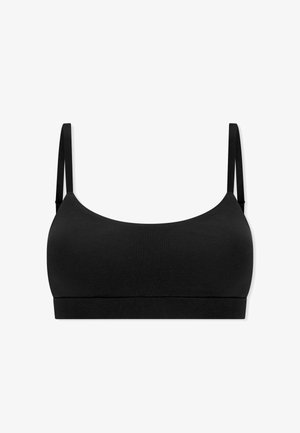 Brassière noire sans coutures avec de fines bretelles réglables et une large bande sous poitrine, conçue pour un porté quotidien confortable.
