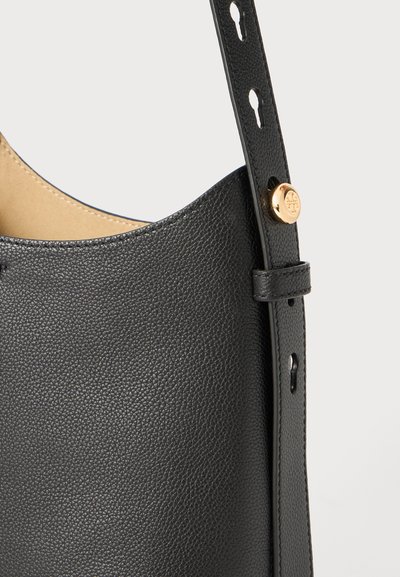 Black leather shoulder bag with a textured finish, curved shape, and adjustable strap featuring gold hardware detail.