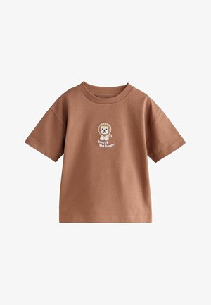 Brązowa koszulka dla malucha z krótkim rękawem, z małym haftowanym lwem i napisem "król dżungli" na piersi.