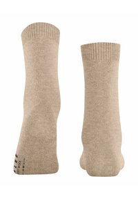 Coppia di calze a coste in lana beige, mostrate da davanti e da dietro su uno sfondo bianco.