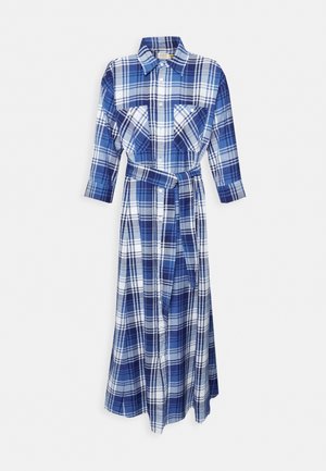 Blue and white plaid shirt dress with long sleeves, collar, two chest pockets, and a belted waist. Made of soft fabric with a flowy design.