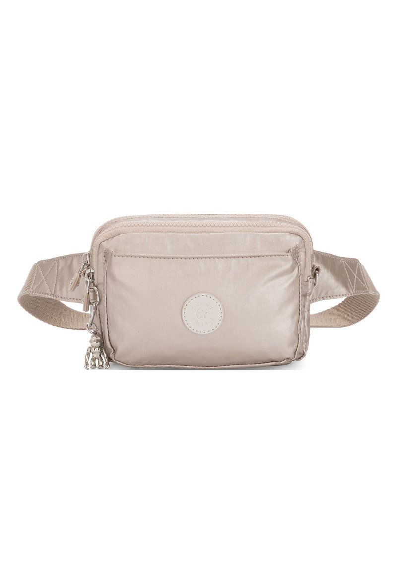 Beige fabric crossbody bag with a front zip pocket, textured surface, and a decorative charm. Features a sturdy strap with adjustable length.