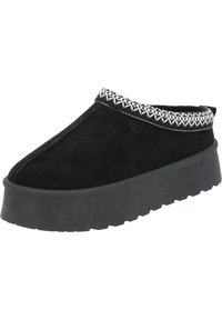 Svart mocka slip-on sko med en tjock gummisula och dekorativt vit stitching runt kragen. Har en rundad tå och texturerad sula.