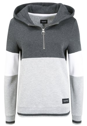 Hallgray ja valge värviga blokiga kapuutsiga sviiter, millel on lukuga kaelus. Omab avarat kapuutsi ja soonikkraed varrukatel ning allservas. Materjal on pehme.