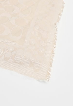 Beige woven scarf featuring a textured circular pattern and frayed edges, showcasing a subtle sheen and soft finish.