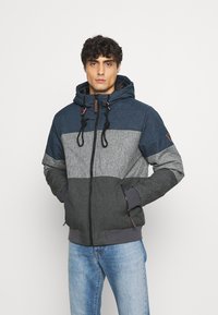 Men's hooded jacket in shades of blue and gray. Features a zip front, drawstrings, and textured fabric with color-blocked design.