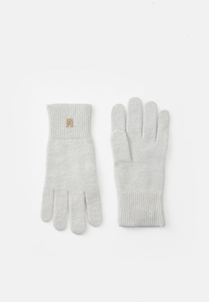 Grijze gebreide handschoenen met een geribde manchet, voorzien van een klein gouden embleem op het polsgebied. Gemaakt van zacht materiaal, ontworpen voor warmte.