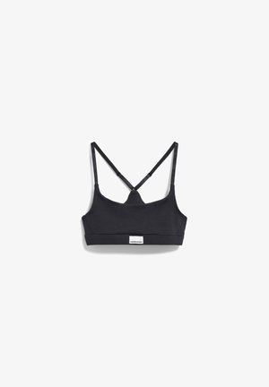 Soutien-gorge de sport noir avec un design sans coutures, des bretelles réglables et une étiquette de marque à l'avant. Tissu doux et extensible ainsi qu'une silhouette simple.