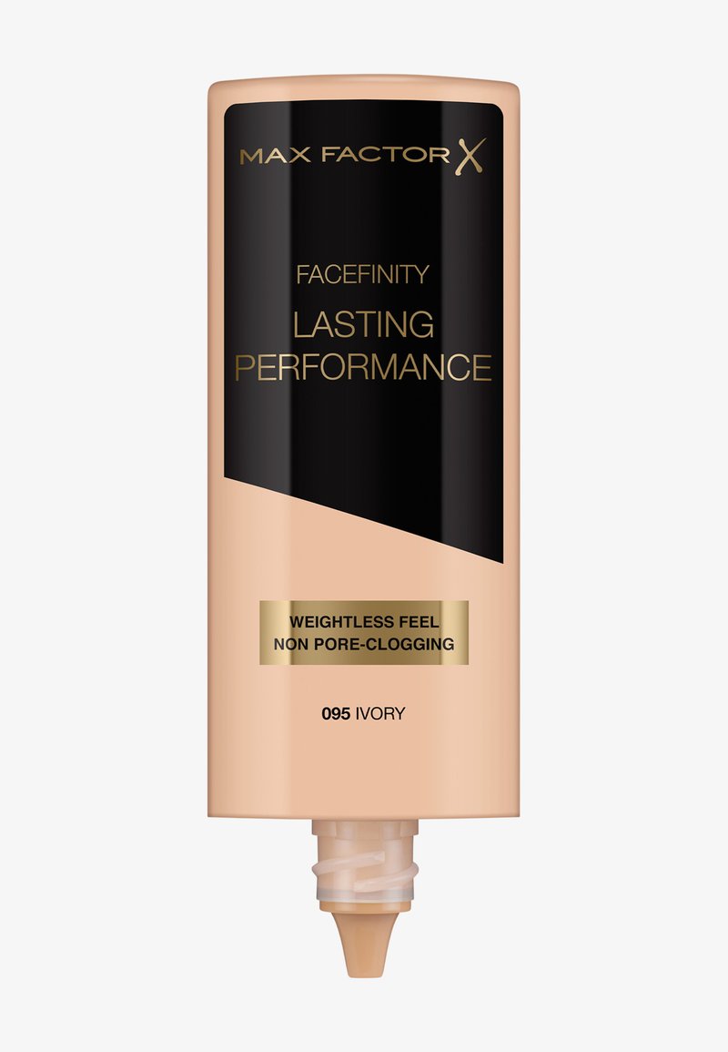 Fondotinta Max Factor Facefinity in avorio, tubo cilindrico beige con etichetta nera e accenti dorati, dotato di un beccuccio per la distribuzione.