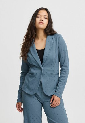 Blue polka-dotted blazer with a tailored fit, single-button closure, and two front pockets. Textured fabric with a smooth finish.
