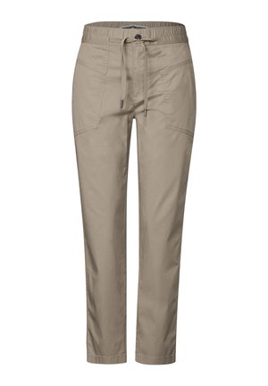 Béžové, lehké kalhoty s elastickým pasem a stahovací šňůrkou, které mají boční kapsy a zúžený design u kotníků.