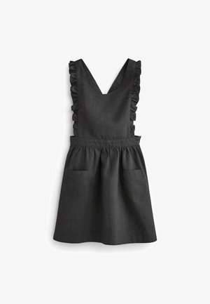 Robe noire sans manches avec bretelles volantées, encolure en V, taille froncée et deux poches avant sur fond blanc.