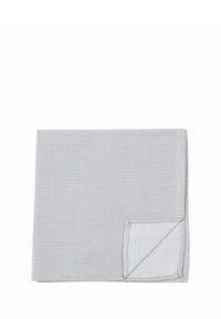 Gray textile tablecloth featuring a textured surface and a folded corner revealing a patterned lining in a lighter color with small dots.