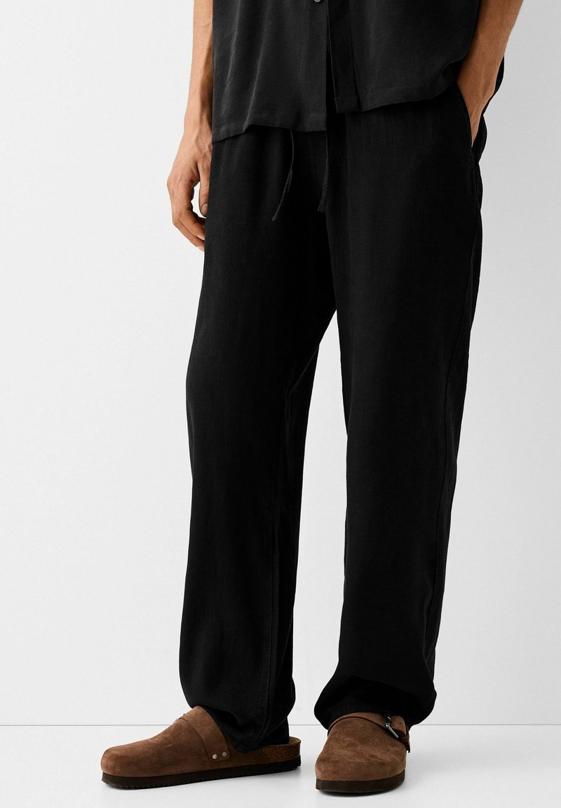 Bershka Tygbyxor - black