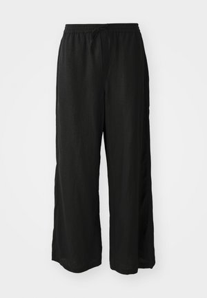 Pantaloni evazați negri, realizați dintr-un material ușor. Talie elastică cu șnur de ajustare. Prezintă slituri laterale aproape de tiv pentru un confort sporit în mișcare.