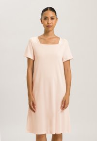 Light pink, square-neck dress with short sleeves and a relaxed fit, made of soft fabric that drapes to mid-calf, featuring a smooth texture.
