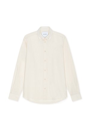 Koszula na długi rękaw z jasnobeżowej tkaniny. Posiada klasyczny kołnierz, sześć guzików z przodu oraz subtelne logo na piersi.