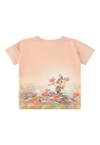 T-shirt a maniche corte rosa pallido con un coniglio che tiene dei fiori, con una stampa floreale dai colori vivaci nella parte inferiore. Tessuto in cotone morbido.