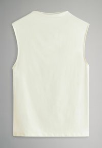 Sleeveless cream tank top made of smooth fabric. Features a round neckline and clean hem with no additional detailing.