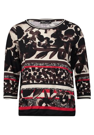 T-shirt à manches longues avec un design imprimé floral et animal en noir, crème et rouge, avec un col rond et des motifs texturés variés.