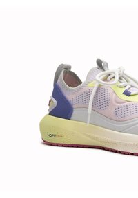 Sneaker with a mesh upper featuring pastel pink, yellow, and purple accents, a thick white midsole, and pink rubber outsole.
