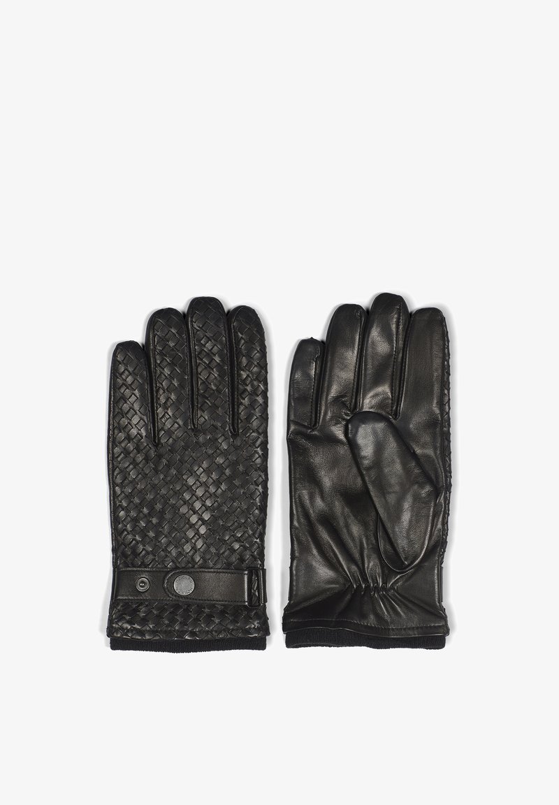 Guanti in pelle nera con texture intrecciata su un lato e finitura liscia sull'altro. Inclusa una strap con un accento metallico al polso.