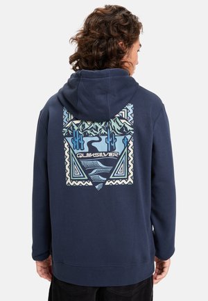 Navy blue hoodie with a large colorful graphic on the back featuring mountains, cacti, and geometric patterns. Soft fabric texture.