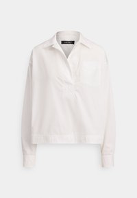 Valge pikade varrukatega särk, valmistatud puuvillast. Omadusteks on krae, poolnööpidega esikate ja üks rinnatasku; ääreosa on veidi lühem.