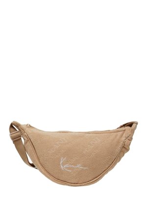 Beige, halvemaanvormige crossbodytas met verstelbare riem en wit "Kani"-logo borduurd aan de voorkant.