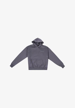 Lilla kapuutsiga dressipluus pehmest kangast, millel on ees suur tasku, soonikkoes varrukad ja reguleeritav kapuuts; minimaalne bränding rindkeres.